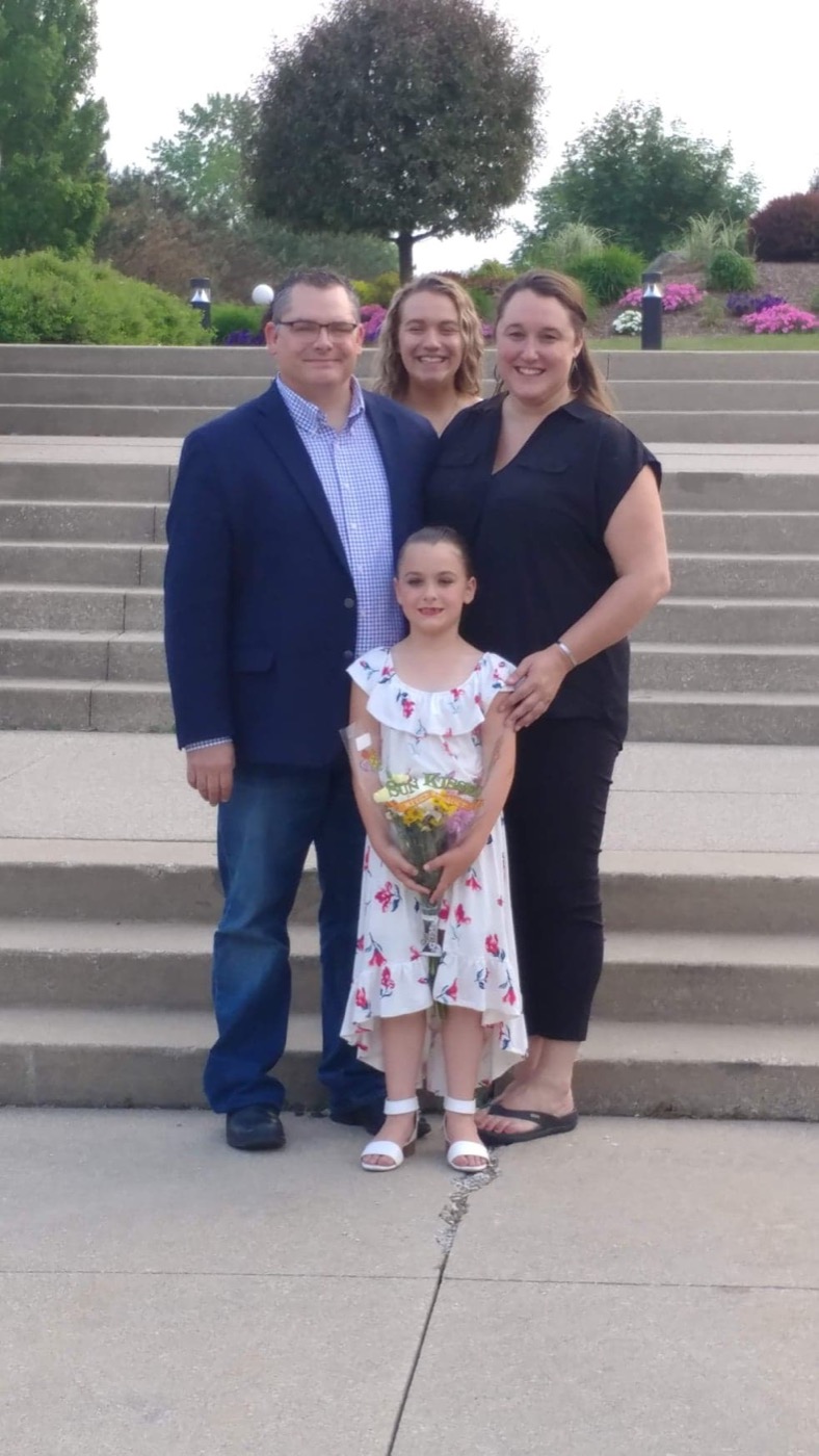 Christopher Judy with his wife Alena and daughters